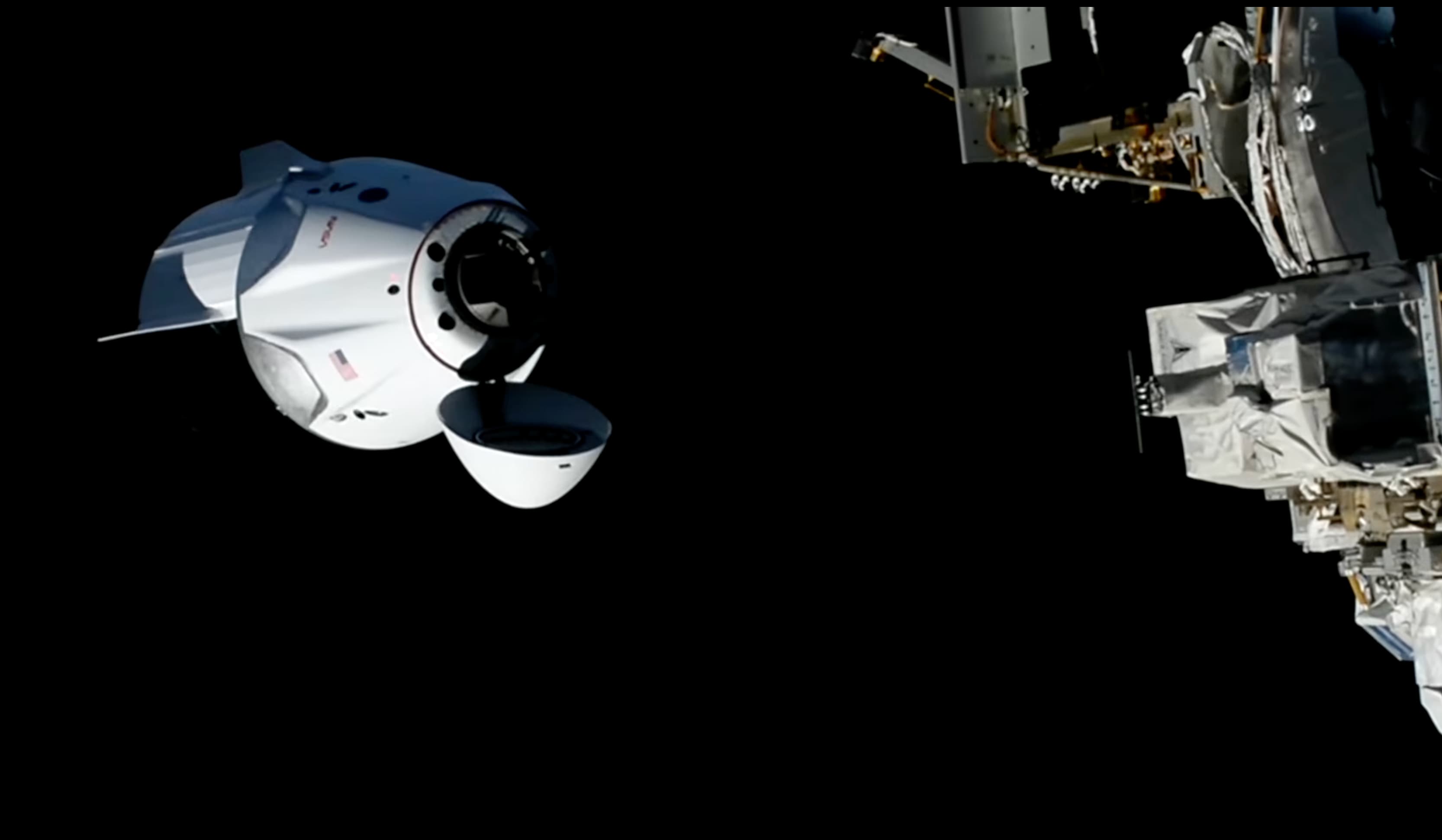 Crew-13 Dragon approaches the International Space Station with its nose cone open
