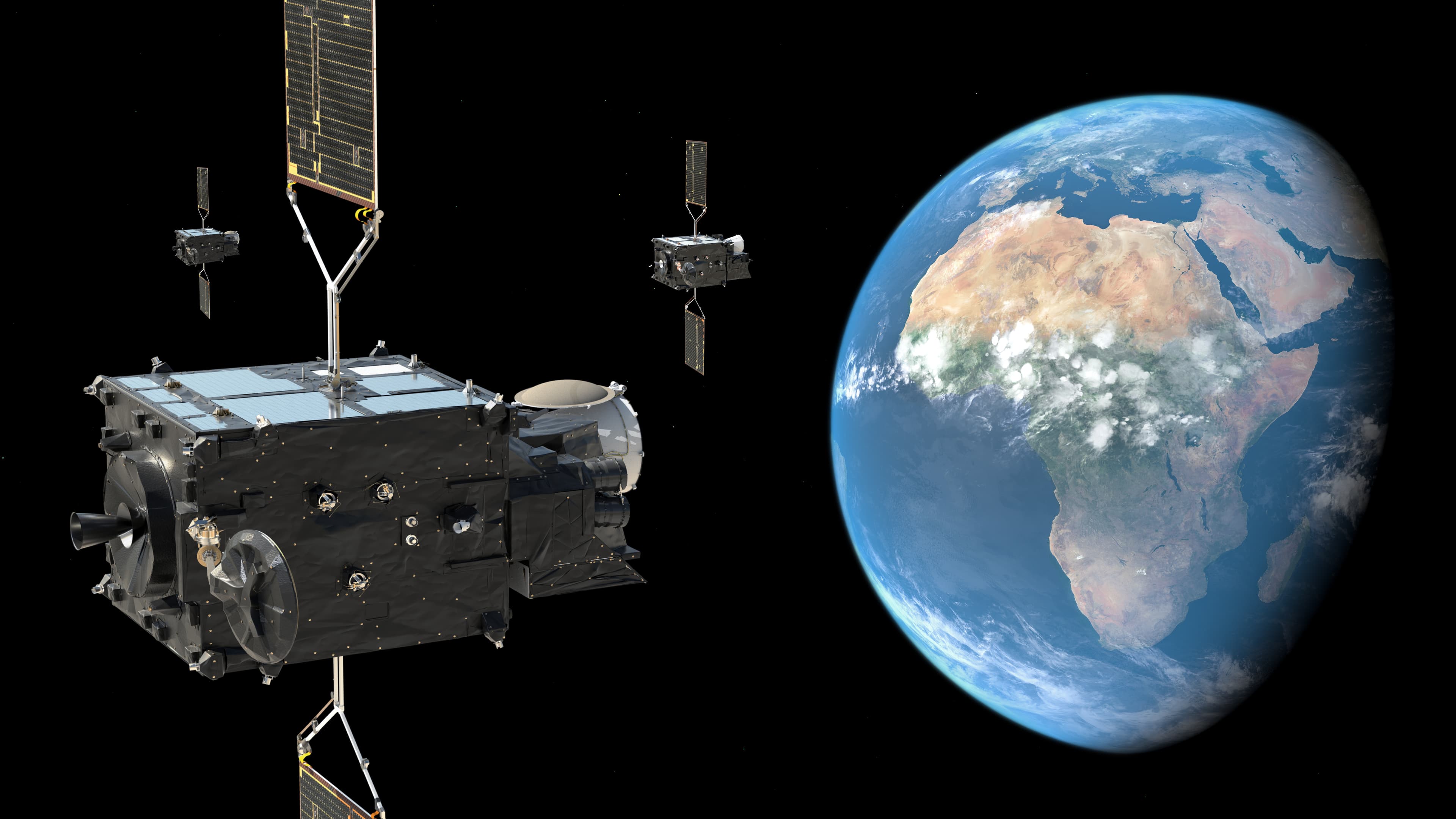 Artist’s illustration of three Meteosat weather satellites beside Earth, with Africa and Europe visible