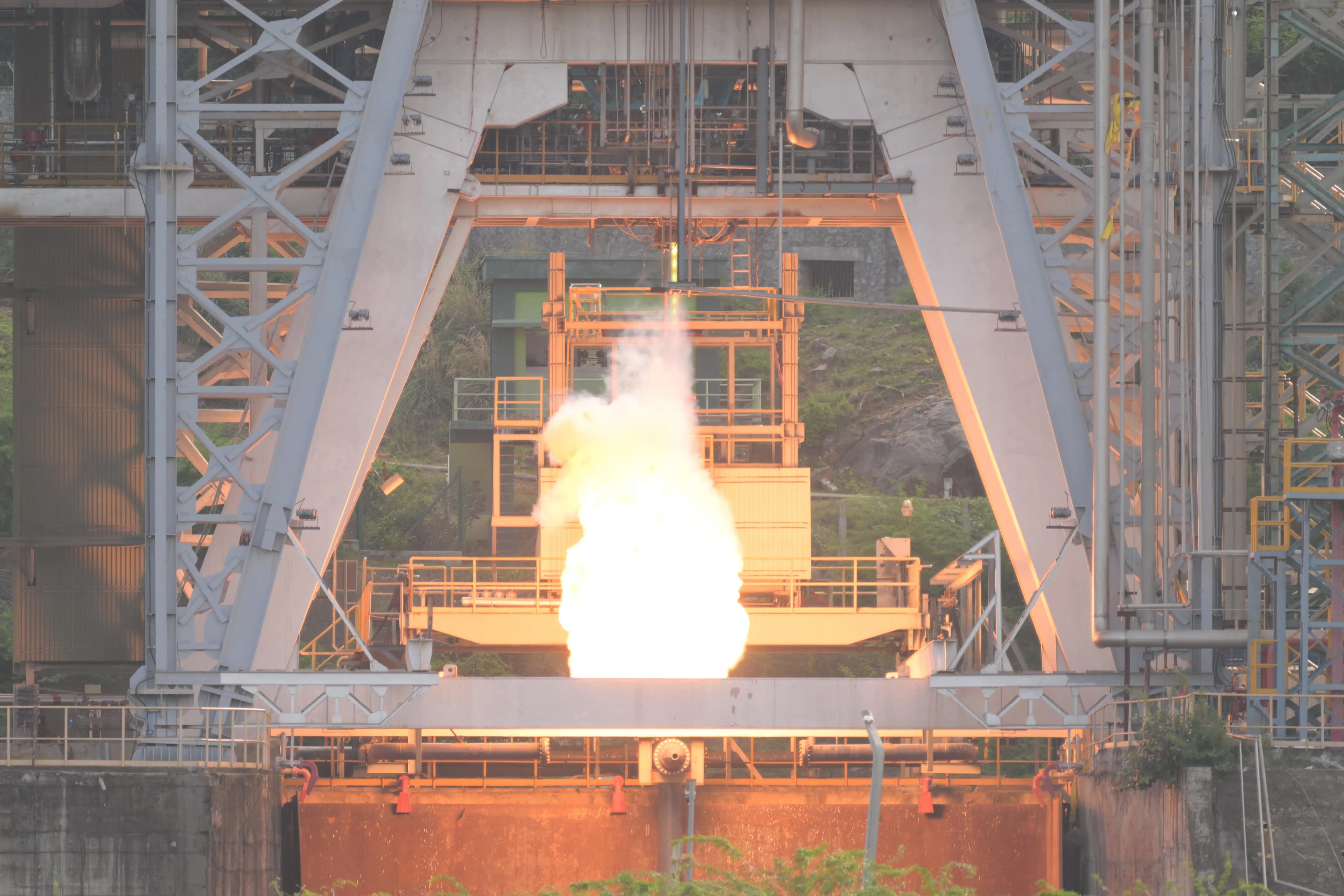 A bright semi-cryogenic engine exhaust plume firing vertically inside ISRO's Mahendragiri test stand