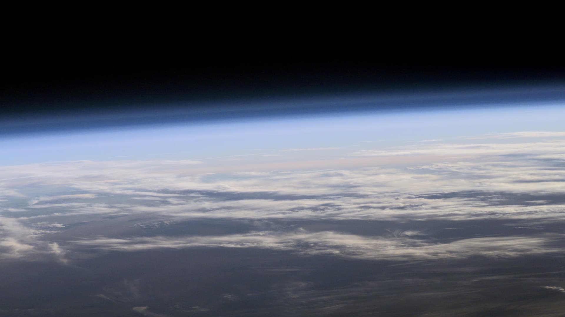 Cloud layers and the blue edge of Earth’s atmosphere viewed from orbit