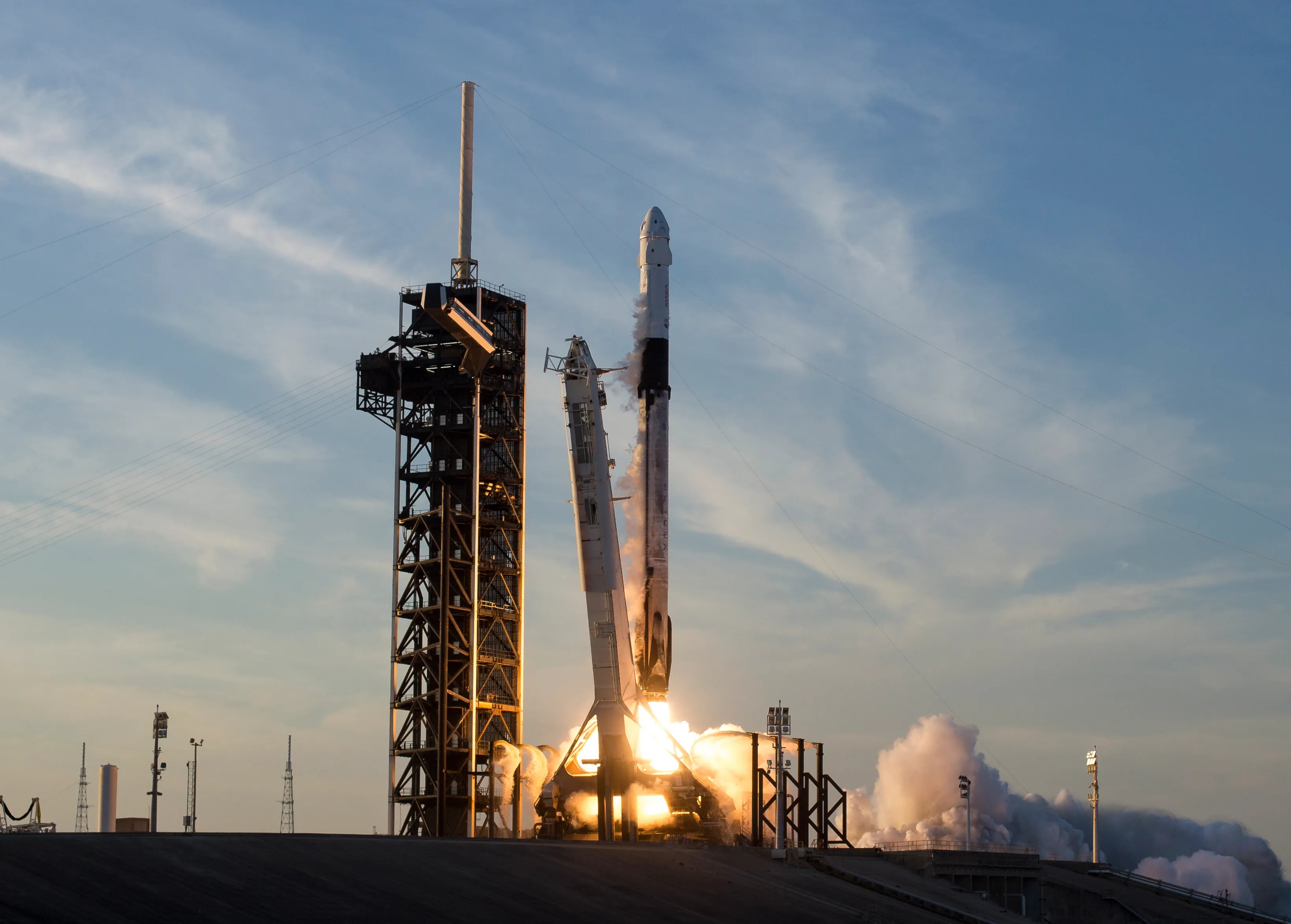 A SpaceX Falcon 9 rocket with a Dragon spacecraft lifts off from Kennedy Space Center