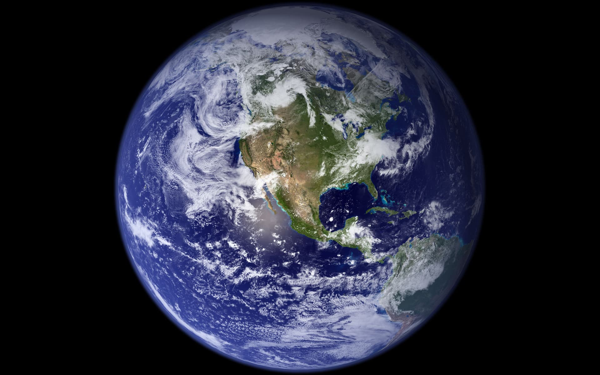 Satellite-based composite of Earth with North America, ocean and swirling white clouds against black space